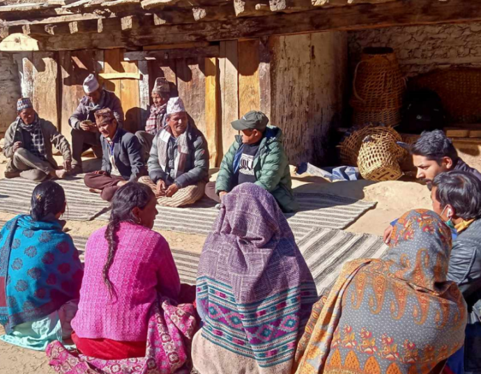 A community forest user group discussing how to sustainably manage plant resources in their region © ANSAB